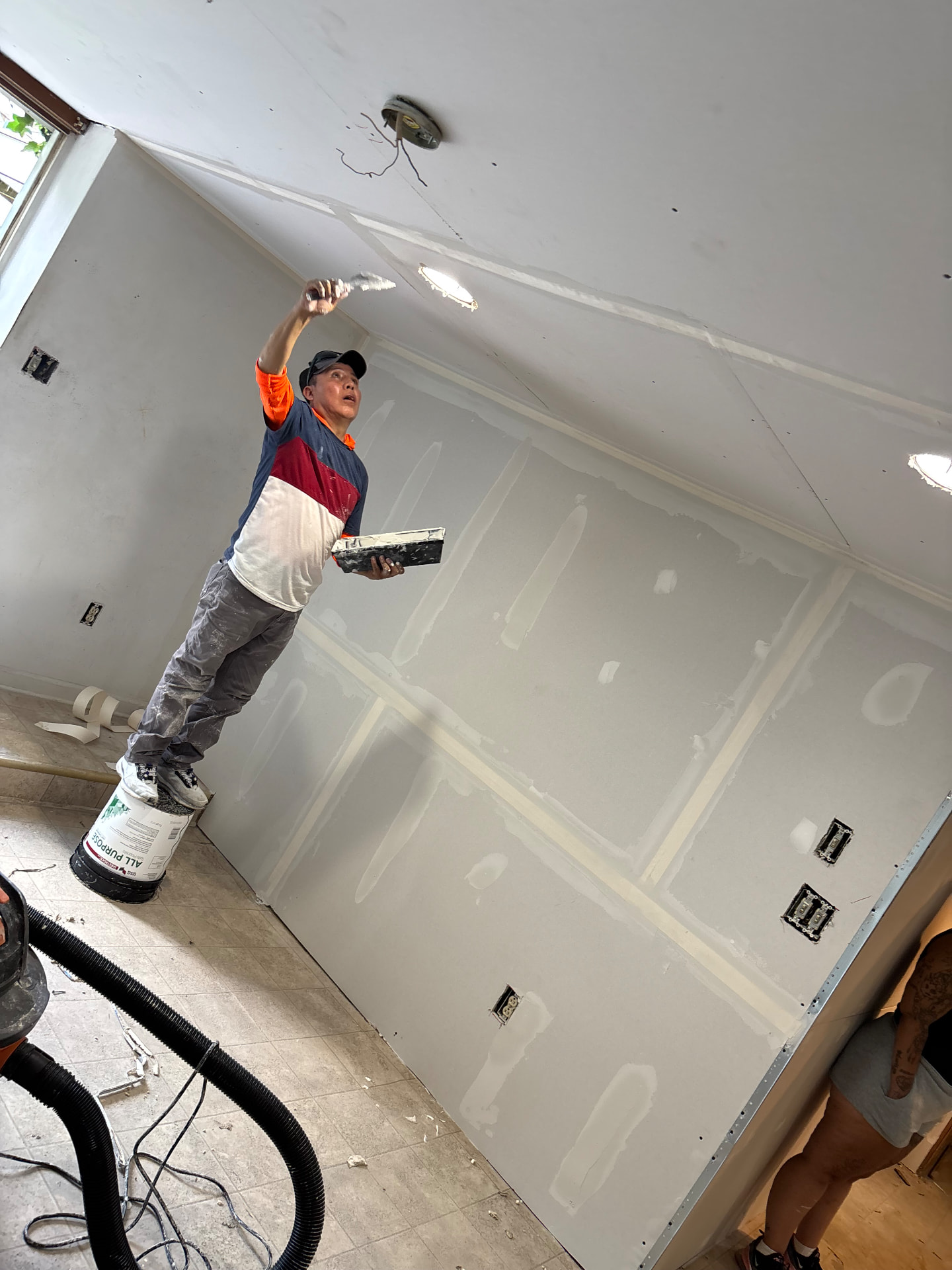 Bedding Coat — Applying the first coat of joint compound to ceilings and walls, creating a smooth foundation for the second coat and final finish.